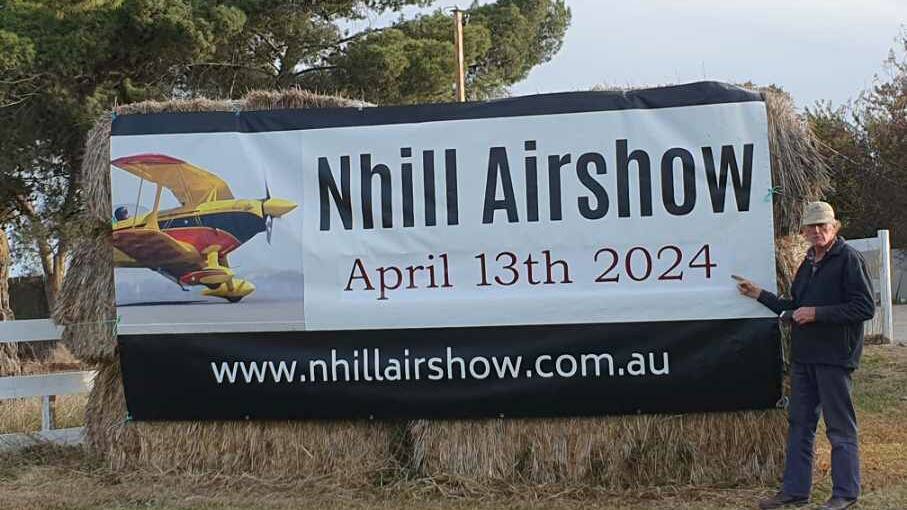 Nhill Airshow convenor Rob Lynch sets up the Nhill Airshow banner. Picture supplied.