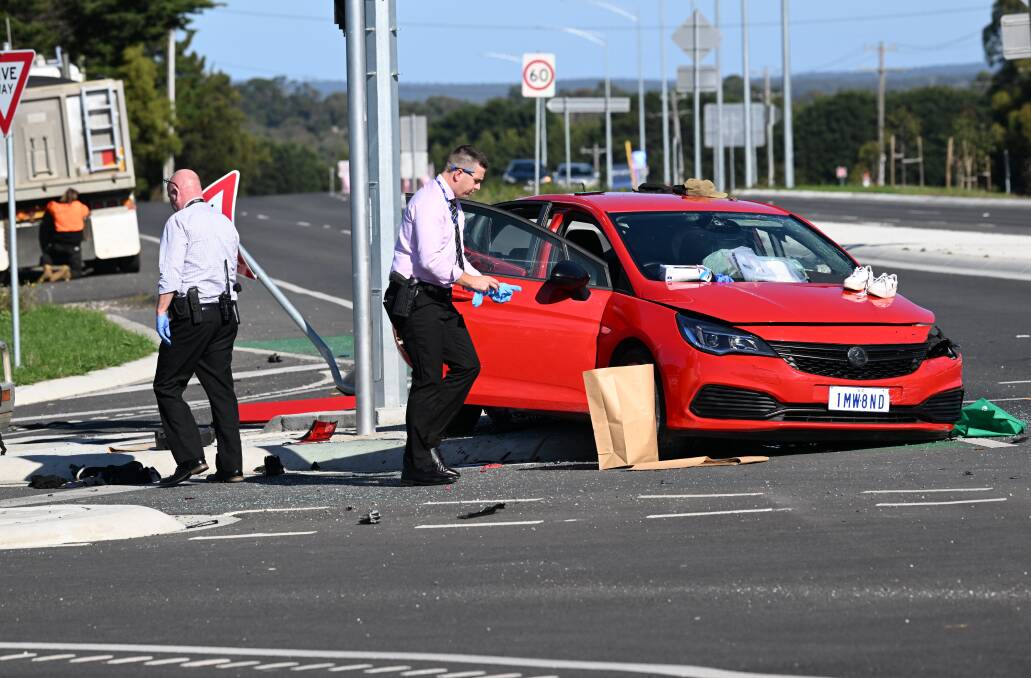 Detectives check out the crash in Sebastopol. Picture by Lachlan Bence
