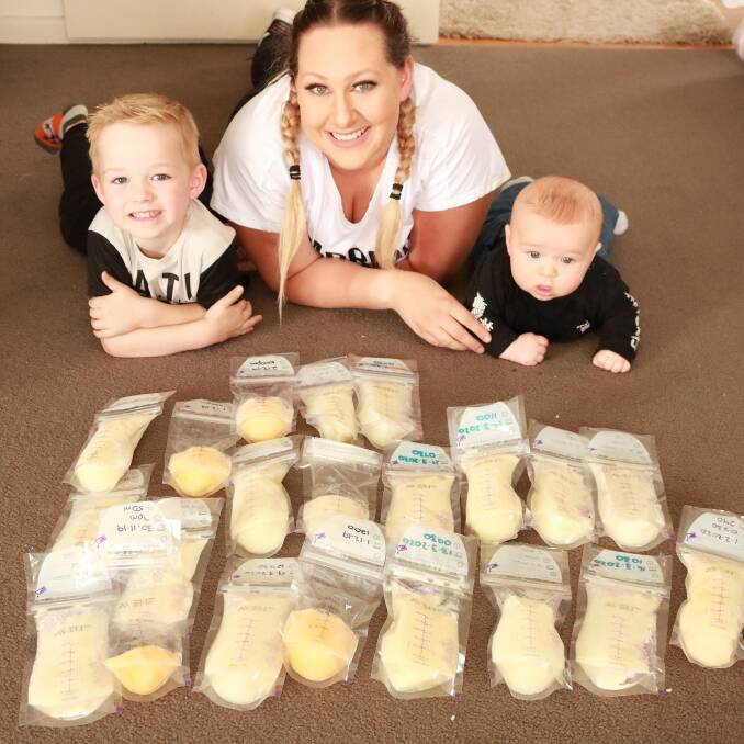 MILK BANK: Horsham mother and clinical educator Bree Stonehouse with her children Kayden (left) and four-month-old Arlo (right) with some of her frozen breast milk. Picture: SUPPLIED