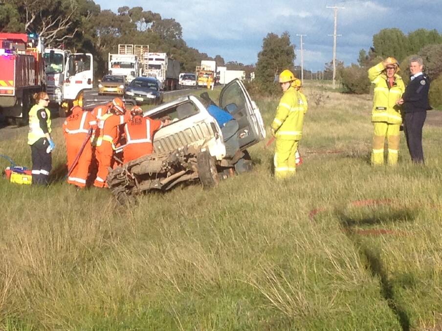CRASH: Emergency services work to free the female passenger in a ute after a crash on the Western Highway near Green Lake. Picture: PAUL CARRACHER